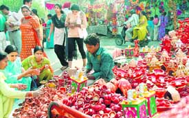 People buy earthen lamps on the eve of Diwali in Chandigarh