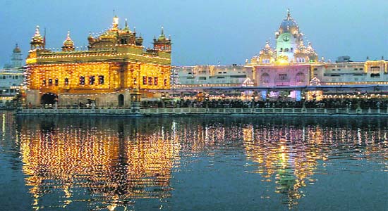 amritsar golden temple images. An illuminated Golden Temple