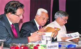 (From left) Prof R.C. Sobti, VC, Panjab University, Prof A.R. Kidwai, Governor of Haryana and Pawan Kumar Bansal, union minister of state for finance, flip through the book “The Flight of Phoenix”, released on the culmination of the diamond jubilee celebrations today at PU