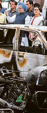 Terror Mountain: Prime Minister Manmohan Singh and UPA chairperson Sonia Gandhi visit the site of the blast outside the district courts in Guwahati on Saturday.