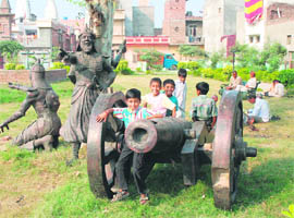 Children play with an ancient cannon at Ibrahim Lodhi’s tomb in Panipat.