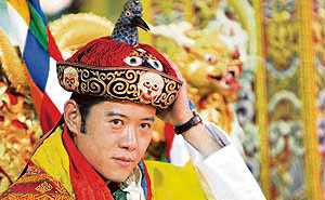 Bhutan's fifth King Jigme Khesar Namgyel Wangchuck adjusts his crown during his coronation ceremony on Thursday.