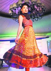 Model Indrani Dasgupta presents a collection from the Fall-Winter collection of Femella Fashions in New Delhi on Wednesday