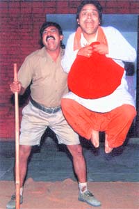 A scene from the play Charan Das Chor