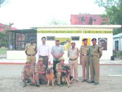 Officials of the Indo-Tibetan Border Police (ITBP) and wildlife departments of Haryana and Uttarakhand with sniffer dogs trained at the National Dog Training Centre, ITBP, Panchkula.