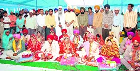 Chief guest DIG Paramjit Singh Gill blesses the newly weds in Mandi Gobindgarh