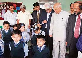 Bihar Governor R.L. Bhatia and Nobel Peace prize winner Dr R.K. Pachauri interact with students of Sat Paul Mittal School in Ludhiana