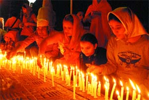 Devotees light candles at the Model Town gurdwara to celebrate the birth anniversary of Guru Nanak Dev on Thursday.