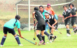 Guru Nanak Dev Engineering College, Ludhiana, and BCET, Gurdaspur eves in action during the Punjab Technical University Inter-College Hockey Tournament being played in Ludhiana on Thursday.