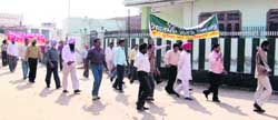 Journalists take out a procession at Sarabha village.