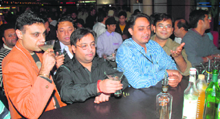 Guests Bond over a peg at a cocktail party held by Smirnoff at PVR Centra Mall before a special screening of Quantum of Solace on Saturday night.
