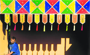 An artist lending colourful strokes to a mud house for the upcoming Chandigarh Carnival at Leisure Valley-10 Lifestyle