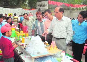 Deputy Commissioner J.S. Ahlawat looks at models at a science exhibition in Fatehabad