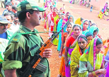 People line up to vote during the second phase in Chhattisgarh in Deopuri village on the outskirts of Raipur