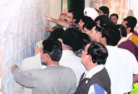 Doon residents throng the office of the Mussoorie-Dehradun Development Authority to have a look at the new map of the Dehradun city under the Master Plan at Dehradun