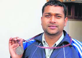 Prem Kumar with his bronze medal won at 9th National Paralympic Swimming Championship held at Karnal, Haryana this year
