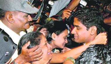 Parents of freed hostage Santosh Patil welcome him at the international airport in Mumbai