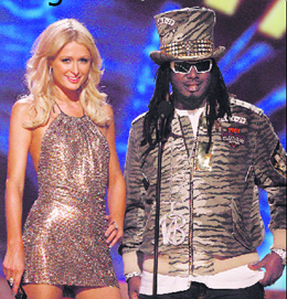Paris Hilton and T-Pain are seen at the American Music Awards in Los Angeles on Sunday.