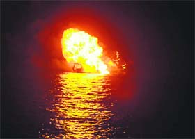 In this Indian Navy handout picture shows an alleged pirate vessel burning after being hit in the Gulf of Aden on November 18