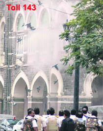 Smoke billows out from the Taj as gunbattle rages between terrorists and security forces.