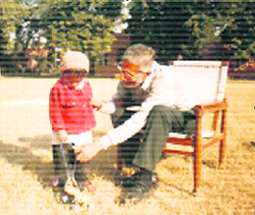 Gram director M.M. Godbole plays with a child.