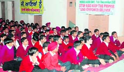 Students of MGMN Senior Secondary School during a seminar on AIDS at Ahmedgarh on Monday.