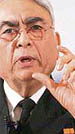 Sureesh Mehta answers a question at a press conference in New Delhi.