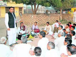 A folk media unit of the information and public relations department performs in a village in Fatehabad.