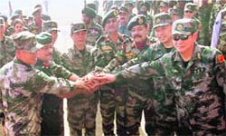 Senior colonel of PLA China Qin Xiang You (3rd from left), Brig S.K. Patiyal (4th from R) and others officials during the inauguration of the Sino-Indian Joint Training Exercise, at Maratha Light Infantry Regimental Centre in Belgaum