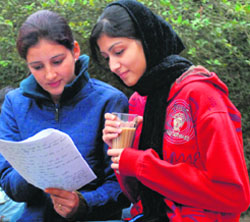 Two friends chill out over tea on the PU campus on Tuesday morning.