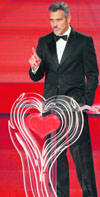 Actor George Clooney delivers a speech during the German telethon Ein Herz fuer Kinder (A heart for children) in Berlin on Saturday. Clooney symbolically received the Golden Heart Award-2008 for different relief organisations that are helping in Sudan.