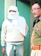 Sanjeev Kumar Yadav alias Deepak Yadav being taken into custody.