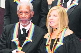 The 2008 Kennedy Center Honorees actor Morgan Freeman and Barbra Streisand pose for a photo after receiving their awards at a gala dinner at the US State Department in Washington. Photo: Reuters