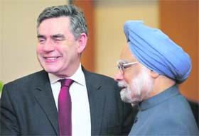 Britain's Prime Minister Gordon Brown is greeted by Prime Minister Manmohan Singh in New Delhi