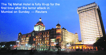 The Taj Mahal Hotel is fully lit-up for the first time after the terror attack in Mumbai on Sunday.  Reuters