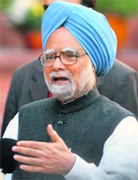 Manmohan Singh talks to the media after the end of the session at Parliament House