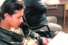 A resident of Amritsar fills up a form on Monday to get his ticket of the Lahore-bound bus cancelled.