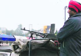 A policeman stands guard on a Gypsy ahead of New Year’s Eve in Ludhiana