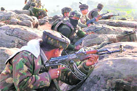 Security personnel take up positions on the 7th day of the Bhatti Dhar encounter in Poonch.