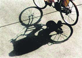 The inter play of light and shade created by a cyclist in the city