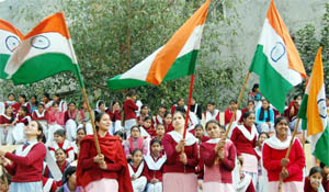 Girls wave Tricolour at the Republic Day rehearsal in Amritsar on Friday.