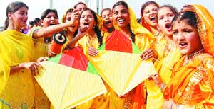 Girls fly kites on the eve of Basant Panchmi in Amritsar