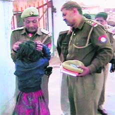 Six-year-old Komal being assaulted by two Uttar Pradesh cops for allegedly stealing money in Etawah district
