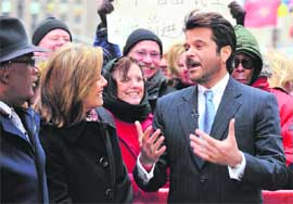 Chit-o-chat: Anil Kapoor (right) who plays the game show host in the movie Slumdog Millionaire, talks with Meredith Vieira, co-host of the NBC 'Today' television program, and weathercaster Al Roker in New York's Rockefeller Center, during his appearance