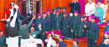 Samajwadi Party members raise slogans and display anti-government banners during the Governors address on the first day of the budget session in the Uttar Pradesh Assembly in Lucknow