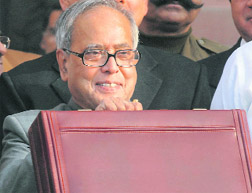 Pranab Mukherjee, who also holds the finance portfolio, arrives to present the Interim Budget in Parliament House on Monday.