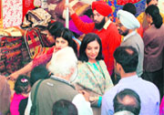 Resplendent in a turquoise and cream suit, that's what Shabana Azmi seems to be saying for having created quite a commotion at the Rajasthan Arts and Craft Festival
