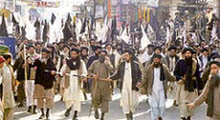 Supporters of Pro-Taliban cleric Sufi Muhammad march in Swats main city of Mingora on Wednesday.
