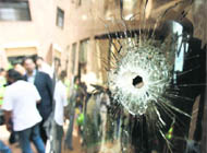 A bullet hole is seen on a windowpane of the bus carrying the Sri Lankan cricket team in Lahore.