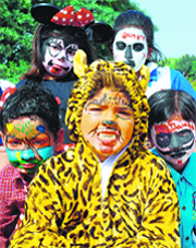 A boy dressed up as Tiger for the face painting competition